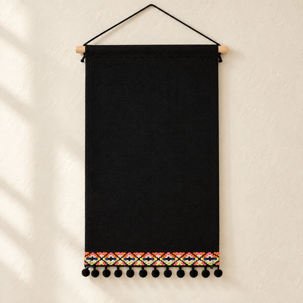 Black Canvas Pin Banner with Pom-Pom Trim — clean ivory wall