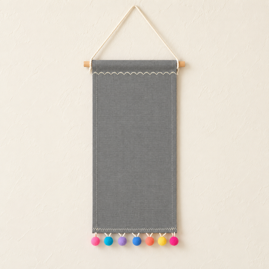 Gray Pom Pom Canvas Pin Pennant — ivory wall hero
